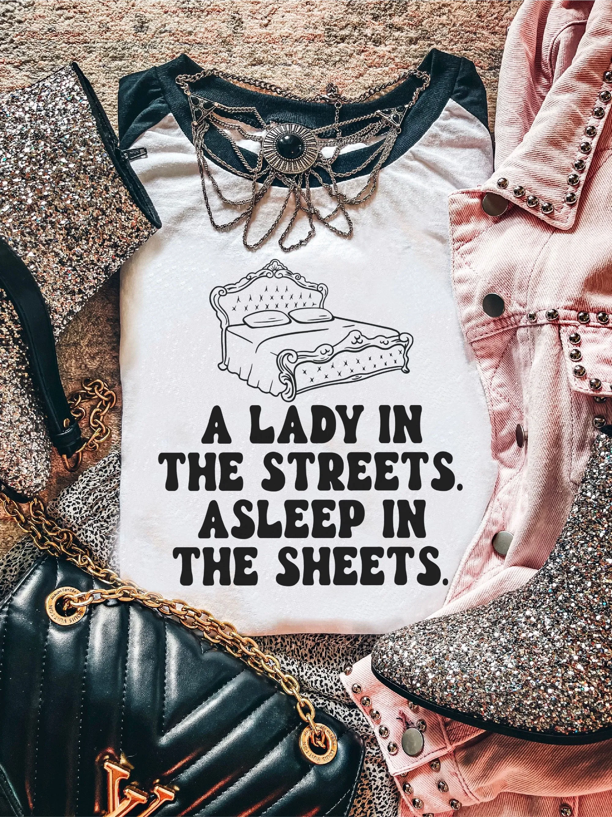 A Lady In The Streets. Asleep In The Sheets.