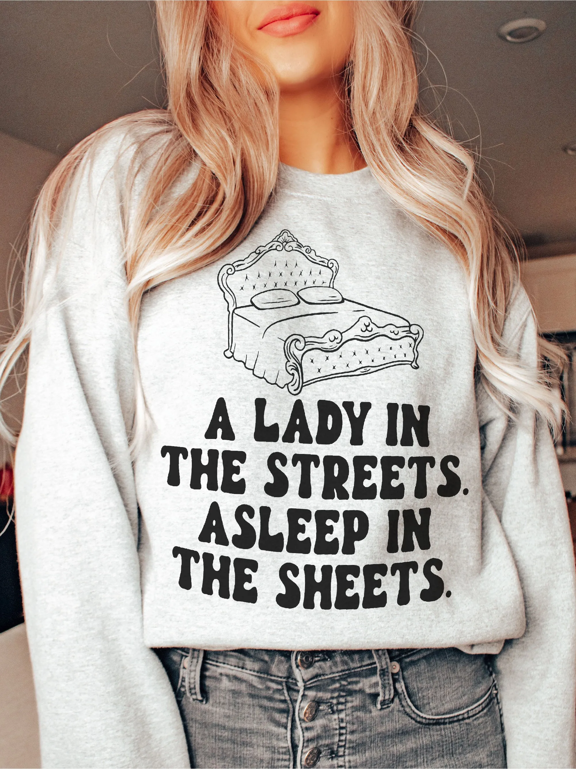 A Lady In The Streets. Asleep In The Sheets.